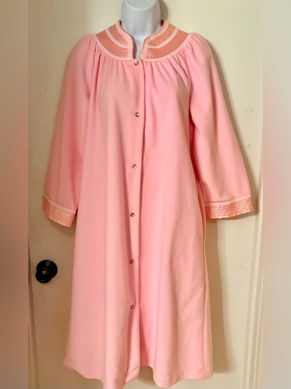 Vintage Pink Women's House Coat with satin and lace trim and pearl snap buttons.